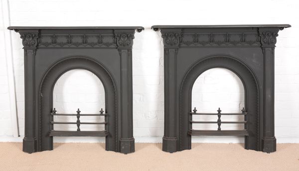 A PAIR OF VICTORIAN CAST IRON FIRE SURROUNDS