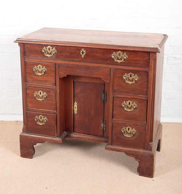 A GEORGE III MAHOGANY KNEEHOLE DESK