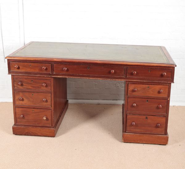 A VICTORIAN MAHOGANY KNEEHOLE DESK