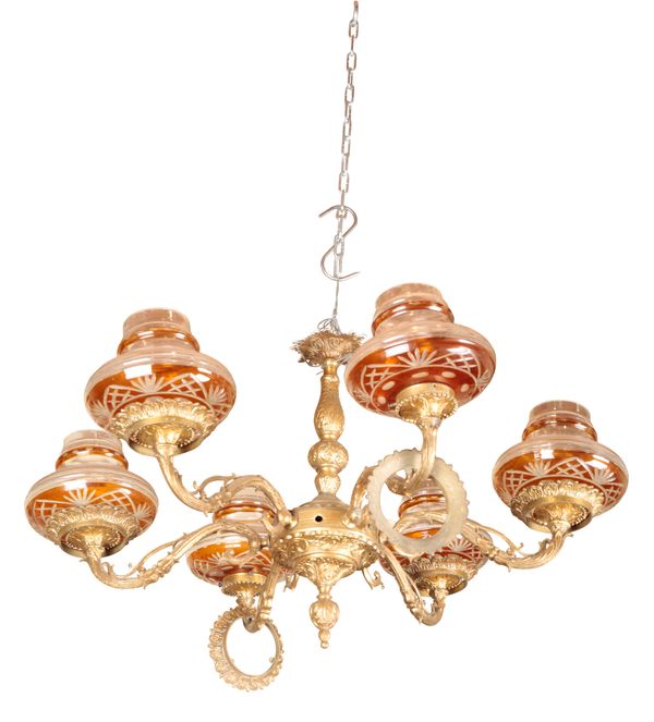 AN EDWARDIAN BRASS CHANDELIER