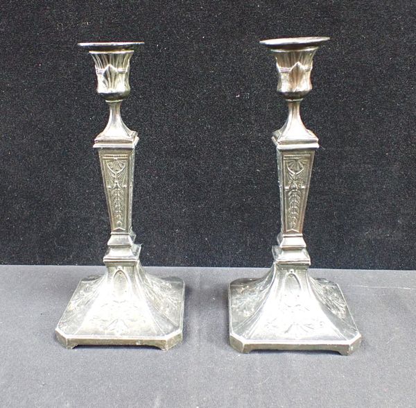 A PAIR OF SPELTER CANDLESTICKS WITH EGYPTIAN REVIVAL MOTIFS