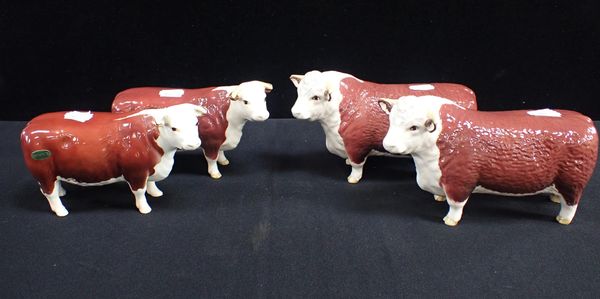 A BESWICK CHAMPION OF CHAMPIONS BULL AND COW