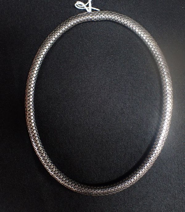 AN ARTICULATED SILVER BRACELET