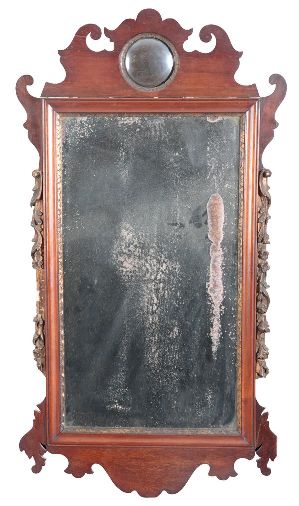 A GEORGE II MAHOGANY AND PARCEL GILT MIRROR