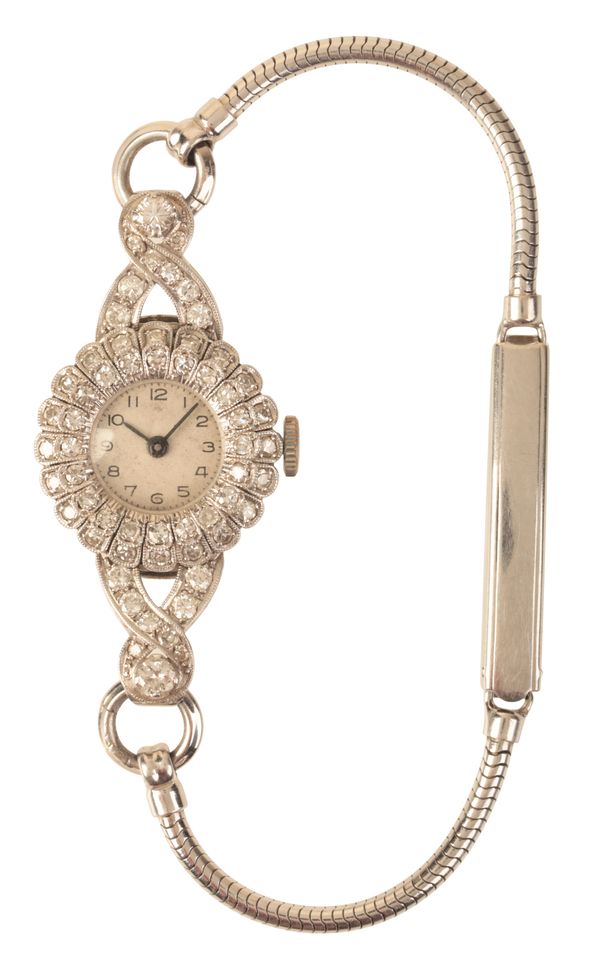 A LADY'S PLATINUM AND DIAMOND COCKTAIL WATCH