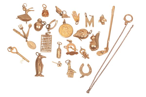 A COLLECTION OF GOLD CHARMS