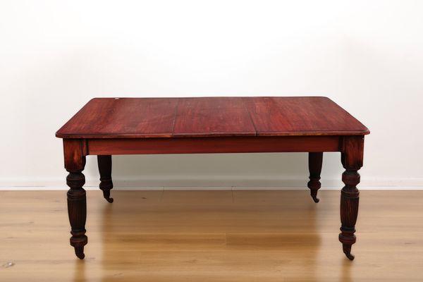 A VICTORIAN MAHOGANY DINING TABLE