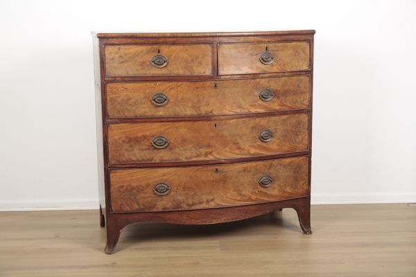 A GEORGE III FLAME MAHOGANY BOWFRONT CHEST OF DRAWERS