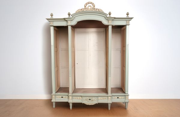 A LOUIS XVI STYLE GREEN AND IVORY PAINTED FRENCH ARMOIRE