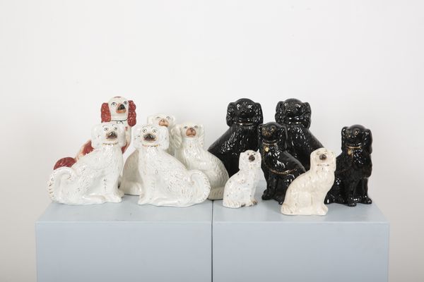 FOUR PAIRS OF SEATED STAFFORDSHIRE SPANIELS