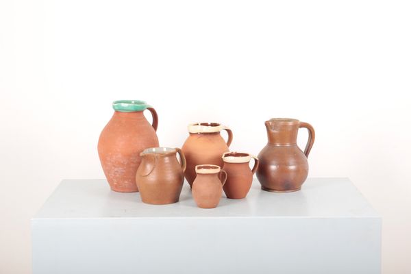 A COLLECTION OF SIX BULBOUS SHAPED JUGS