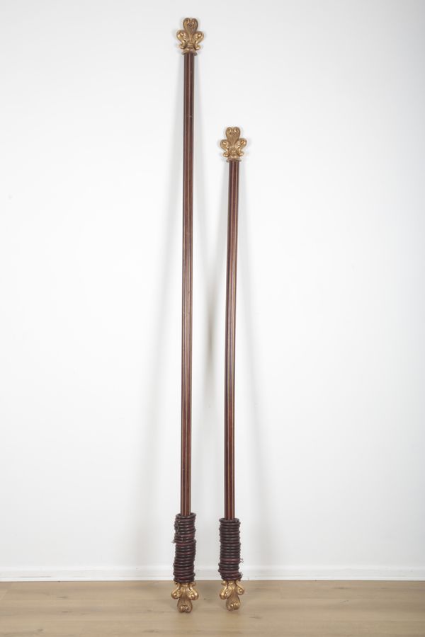 TWO SIMILAR NEOCLASSICAL MAHOGANY AND PARCEL-GILT CURTAIN POLES