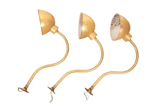 A SET OF THREE PATINATED BRASS WALL LIGHTS
