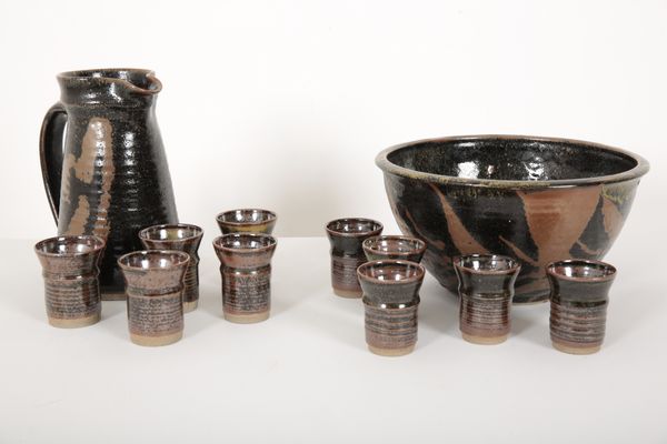 A STONEWARE PUNCHBOWL, JUG AND GOBLETS