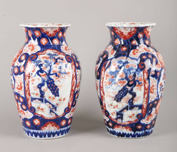 A PAIR OF JAPANESE IMARI PORCELAIN BALUSTER VASES