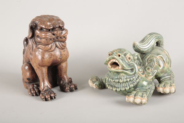 A CHINESE GREEN-GLAZED POTTERY LION DOG