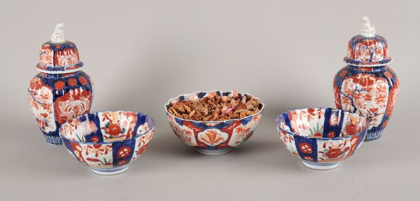 A PAIR OF JAPANESE PORCELAIN IMARI VASES AND COVERS