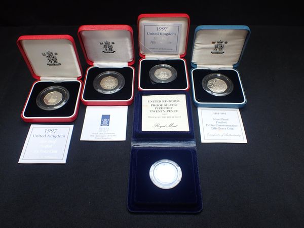 FOUR SILVER PROOF 50 PENCE COINS