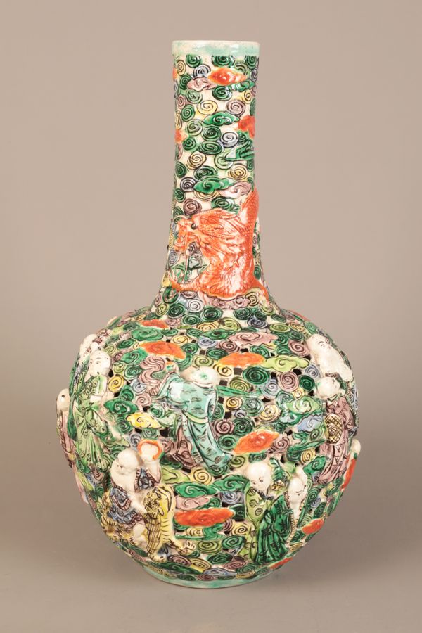 A CHINESE FAMILLE VERTE RETICULATED BOTTLE VASE