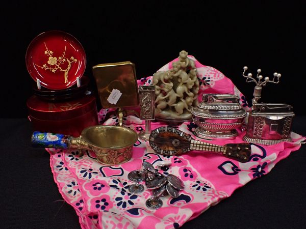 A MINIATURE BRASS TILT TOP TABLE