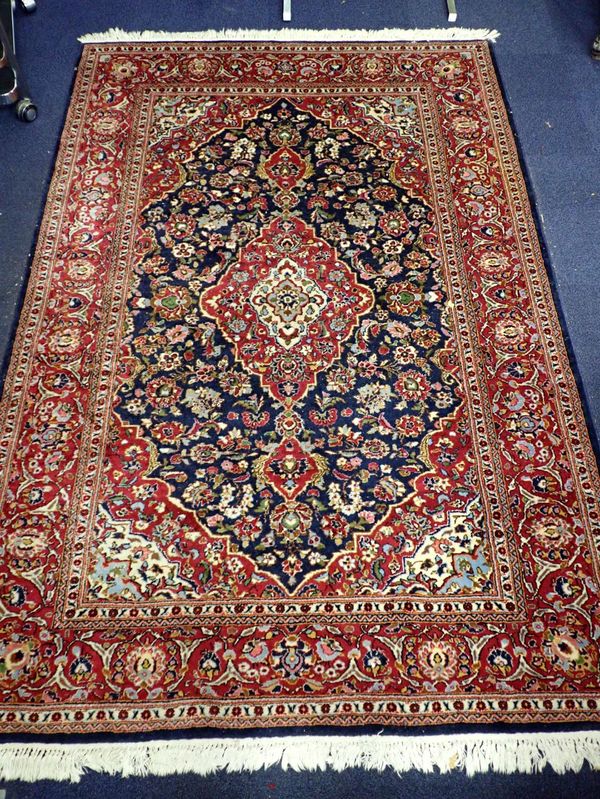 A KESHAN STYLE BLUE GROUND RUG