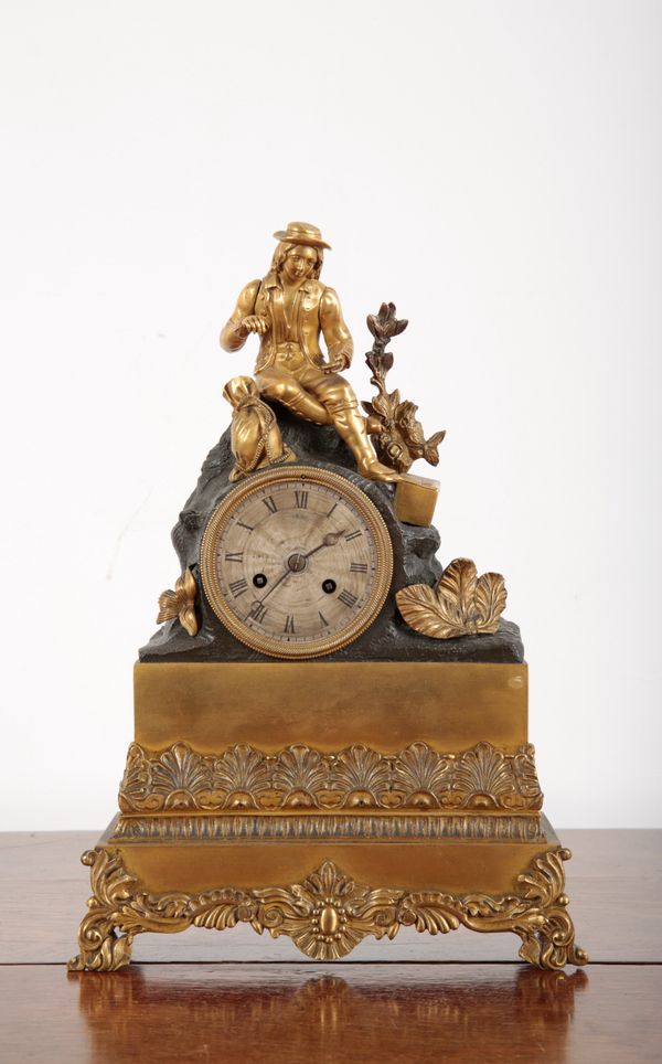 A FRENCH EMPIRE ORMOLU MANTLE CLOCK