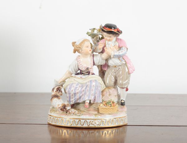 A MEISSEN PORCELAIN FIGURE GROUP ‘THE LETTER’