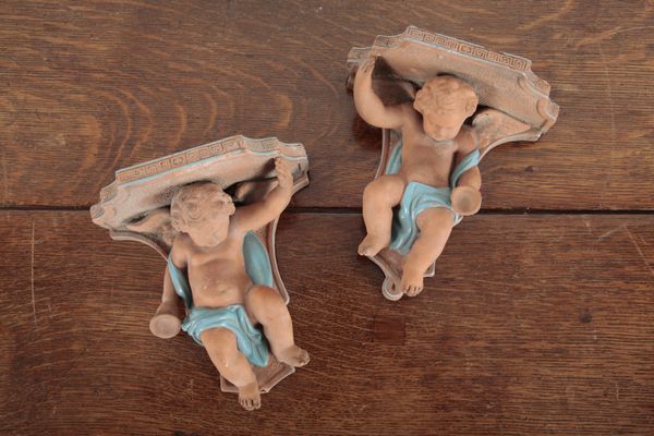 A PAIR OF ITALIAN TERRACOTTA WALL APPLIQUE