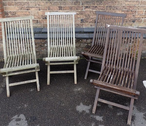 TWO PAIRS OF TEAK FOLDING GARDEN CHAIRS