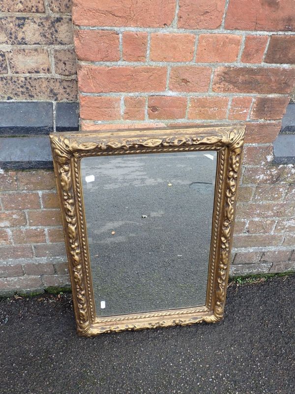 A GILT 'CARTON PIERRE' TYPE FRAMED MIRROR