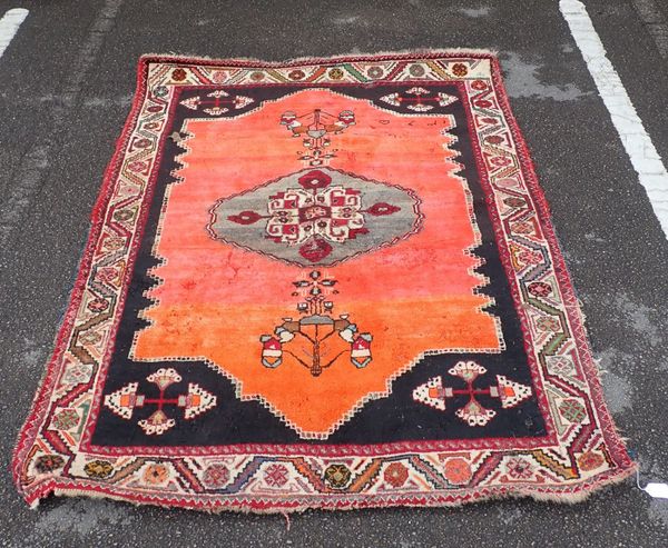 A NORTH WEST IRANIAN RUG, SIGNED