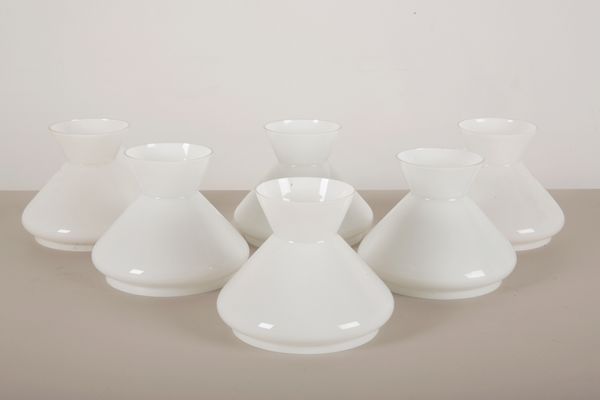 A SET OF SIX WHITE GLASS SHADES