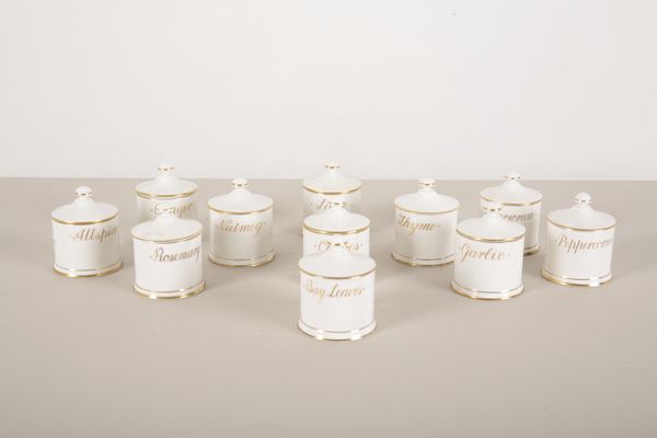 A SET OF ELEVEN QUEENSBURY PORCELAIN SPICE JARS