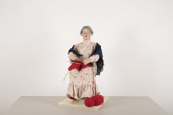 AN AUTOMATON OF AN ELDERLY WOMAN KNITTING