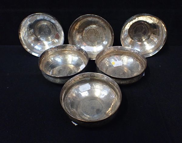 A SET OF SIX WHITE METAL BOWLS