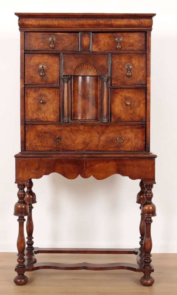 A QUEEN ANNE STYLE WALNUT CHEST ON STAND