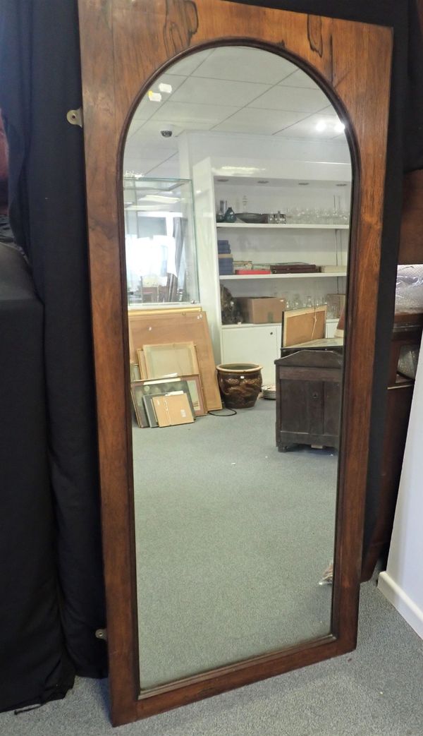 A VICTORIAN ROSEWOOD FRAMED ARCHED FULL-LENGTH MIRROR