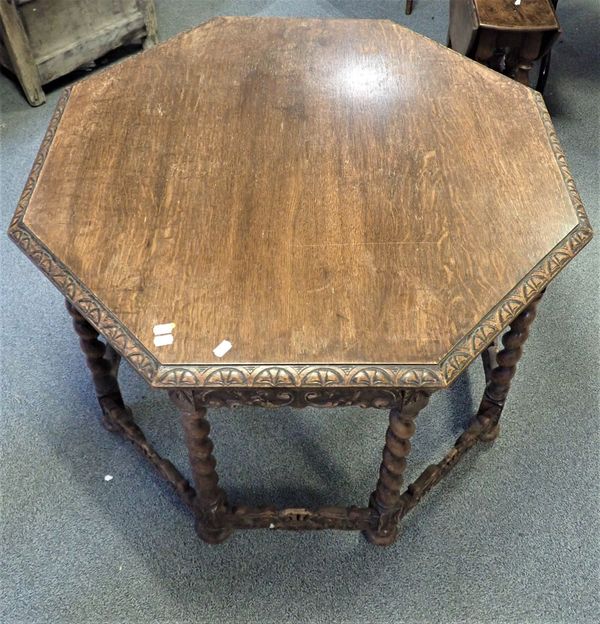 A CARVED OAK CAROLEAN STYLE OCTAGONAL TABLE