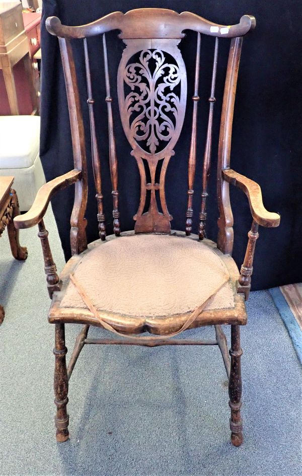 AN EDWARDIAN STAINED WOOD ARMCHAIR