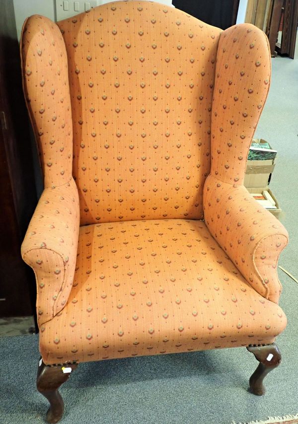 A GEORGE III STYLE WING ARMCHAIR