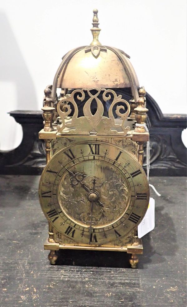 A BRASS LANTERN STYLE CLOCK