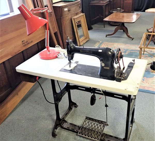 AN INDUSTRIAL SINGER SEWING MACHINE