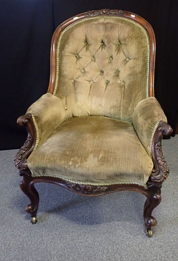 A VICTORIAN WALNUT ARMCHAIR