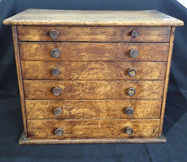 A COLLECTORS CHEST OF DRAWERS