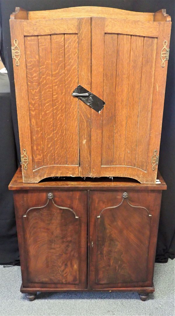 AN EDWARDIAN OAK STATIONERY CABINET