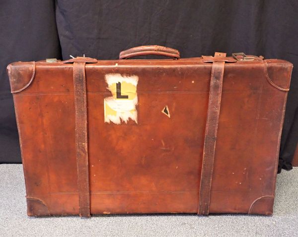 A LEATHER STEAMER TRUNK