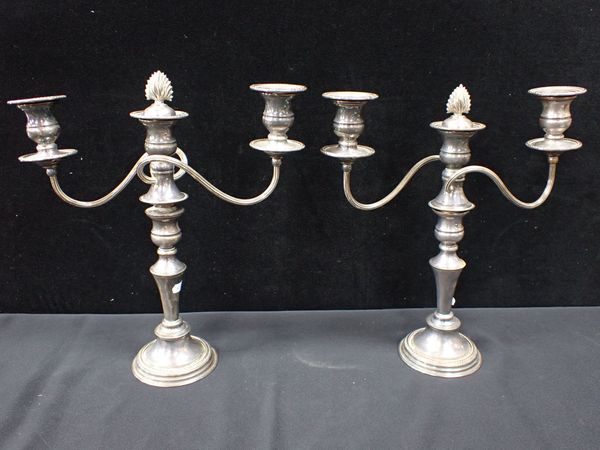 A PAIR OF SILVER-PLATED ON COPPER CANDELABRA