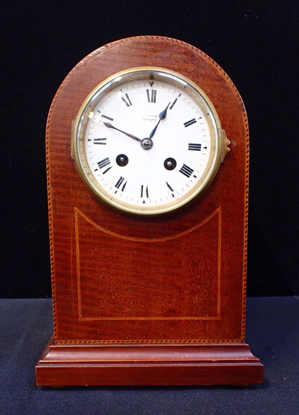 AN EDWARDIAN MAHOGANY MANTEL CLOCK