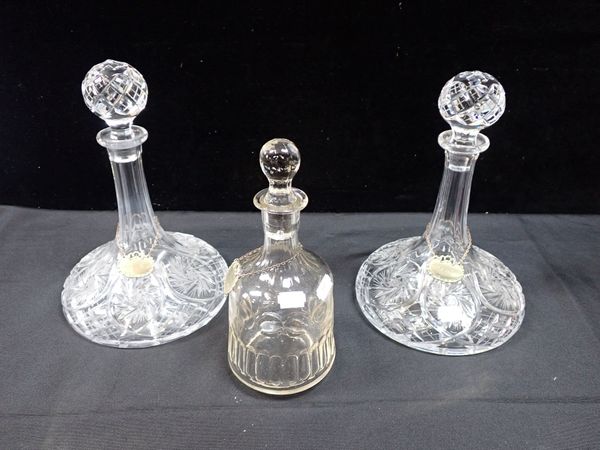 A PAIR OF CUT GLASS SHIPS' DECANTERS