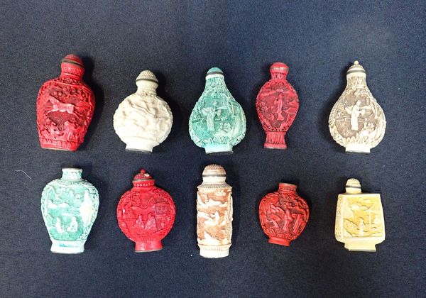 A COLLECTION OF CHINESE CARVED RESIN SNUFF BOTTLES